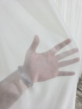 Perdea crem din material plin ca textura, cu sclipici model Santorini