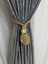 Set magneti ovali cu fir lung, auriu material textil(2bucati)